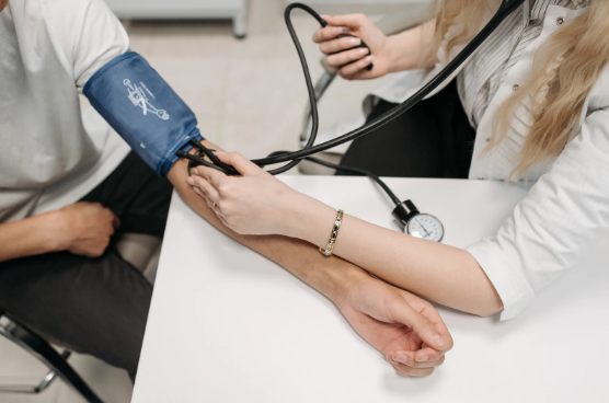 nurse taking blood pressure
